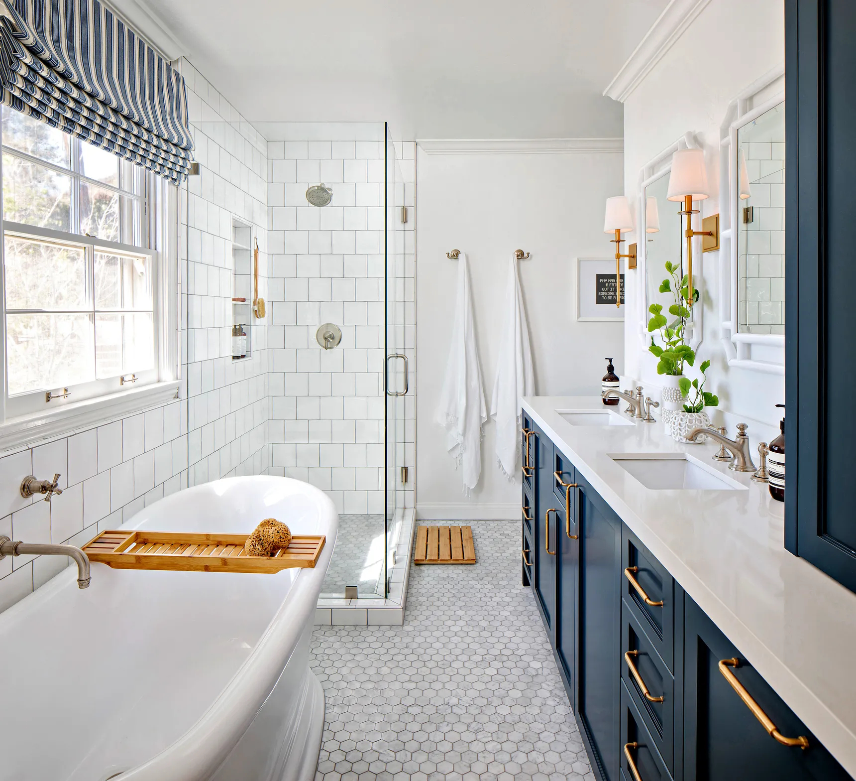 white bathroom with dark blue cabinetries