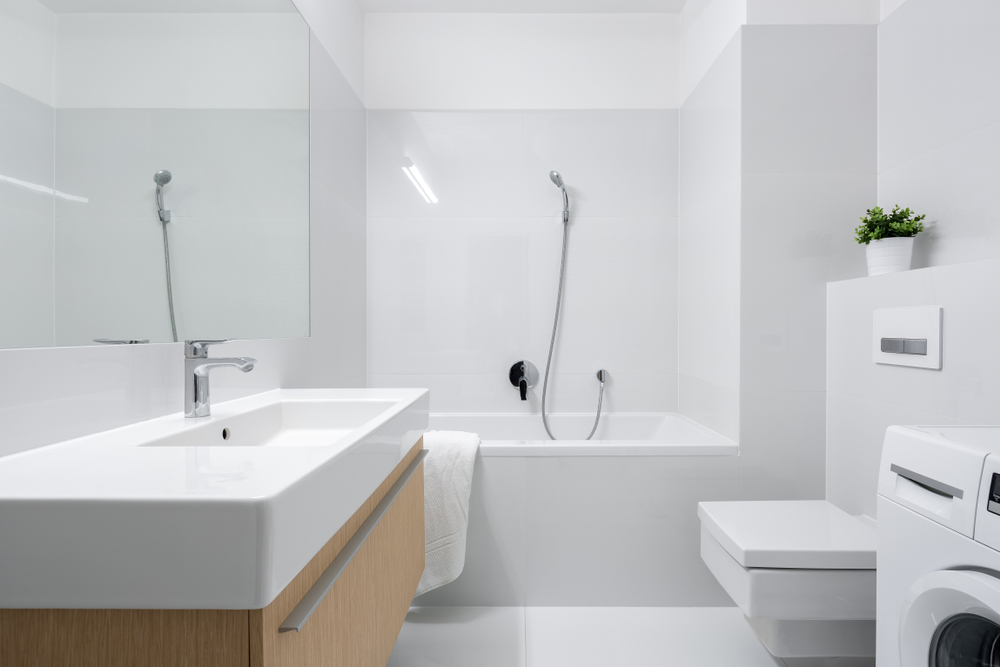 Superdraft_stylish-bathroom-with-big-white-washbasin-wooden-drawer-bathtub-and-washing-machine-01603170988
