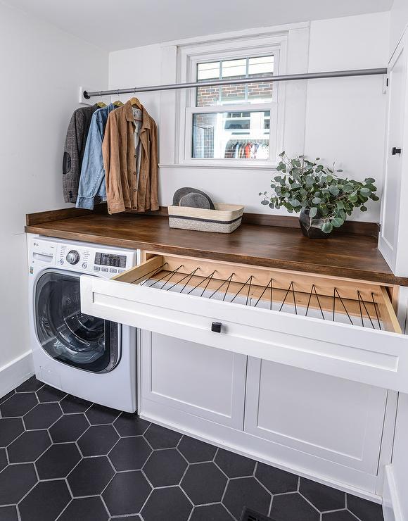 laundry room with pull-out drying rack