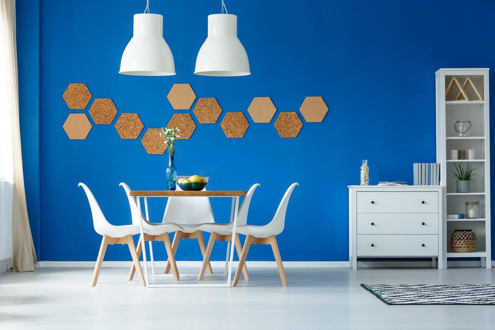 geometric accessories on blue feature wall