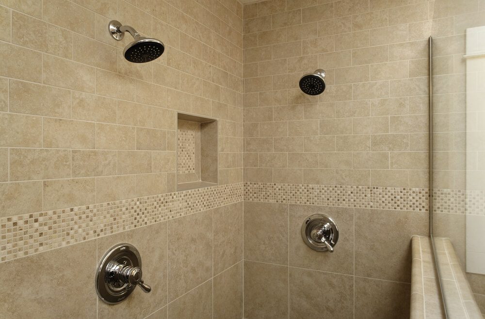 double showers with half wall and glass divider