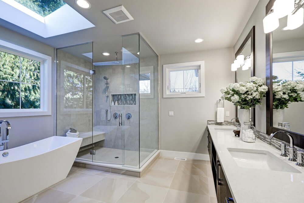 luxurious white bathroom with skylight