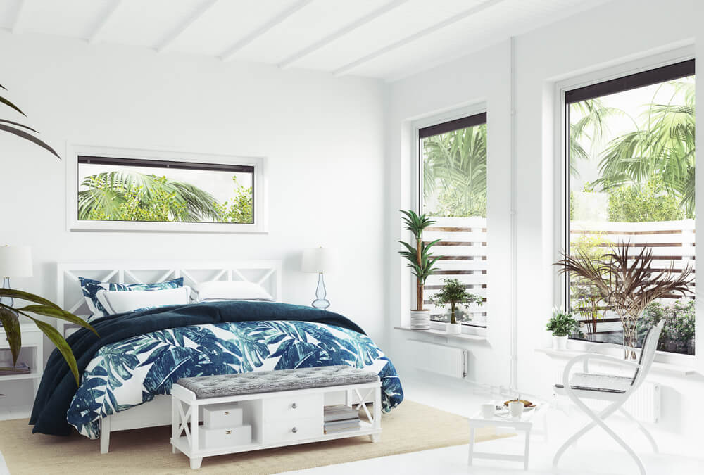 contemporary coastal bedroom with blue printed sheets