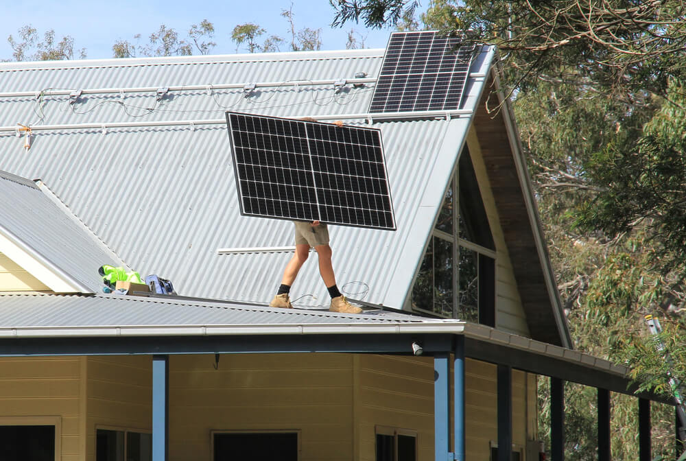 installing solar panels to an energy efficient home