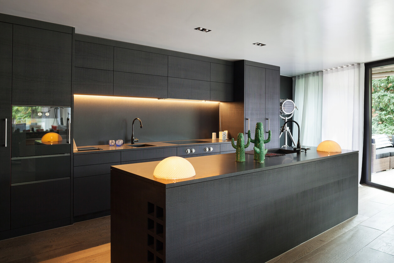sleek black modern kitchen with breakfast bar