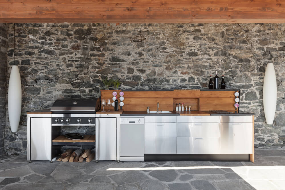 modern kitchen with a bricked wall